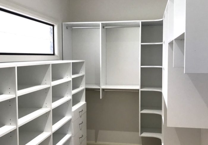 white walk in wardrobe multiple shelves